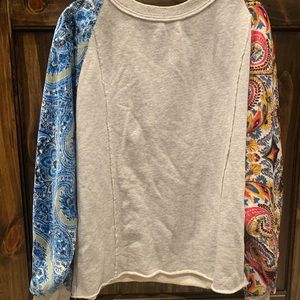 Free People Sweatshirt with quilted patterned sleeves.